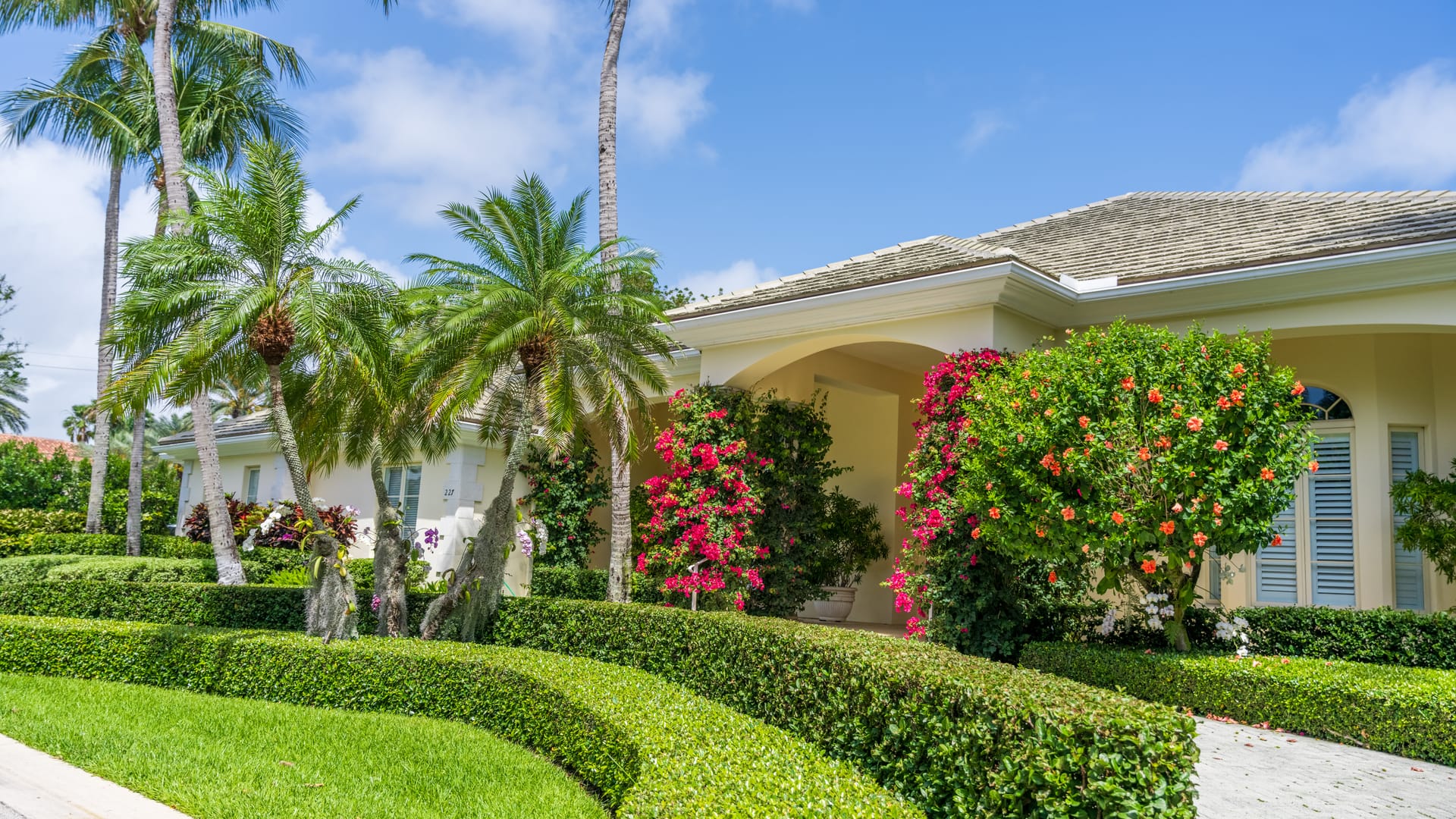 Florida home with a beautiful planted landscape.